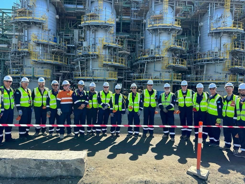 Group of Bechtel team members with Bechtel President and COO Craig Albert in safety gear on a project site.