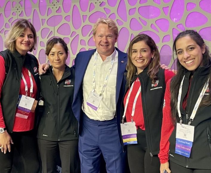 Brendan Bechtel with Bechtel team members at Women's Leadership Conference.