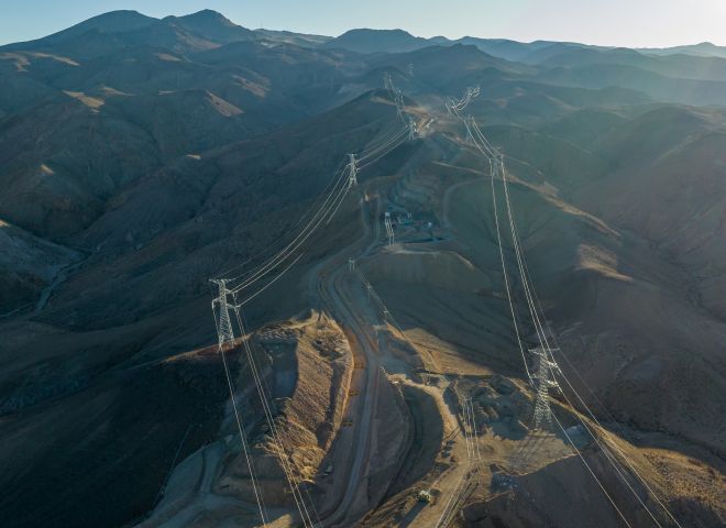 Power lines running through a mountain range.