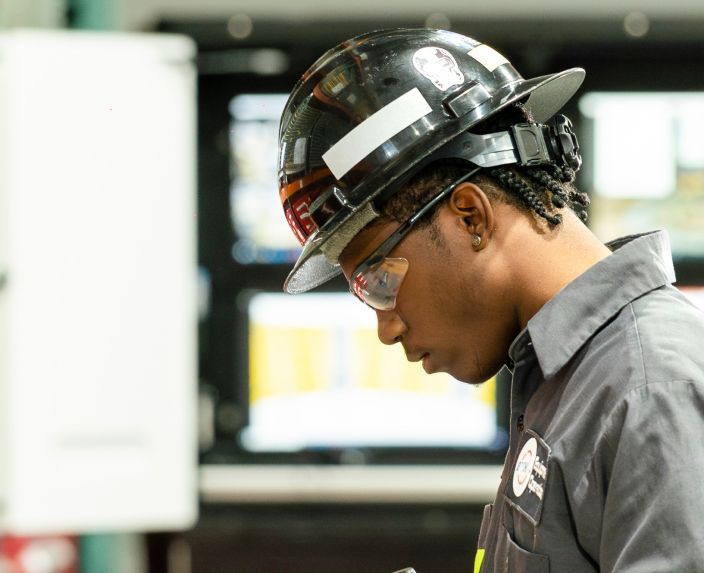 Bechtel team member wearing a hard hat and safety goggles.