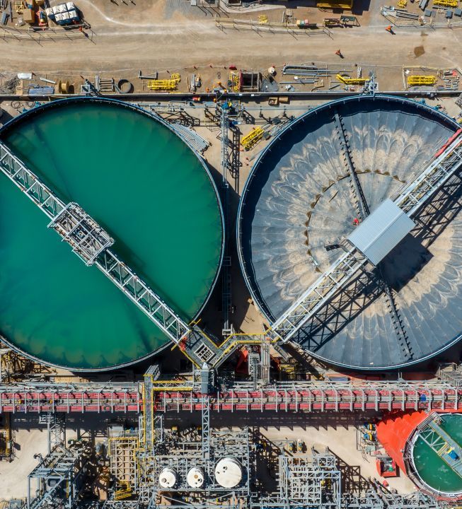 Aerial view of QB2 copper mine, with two large tanks.