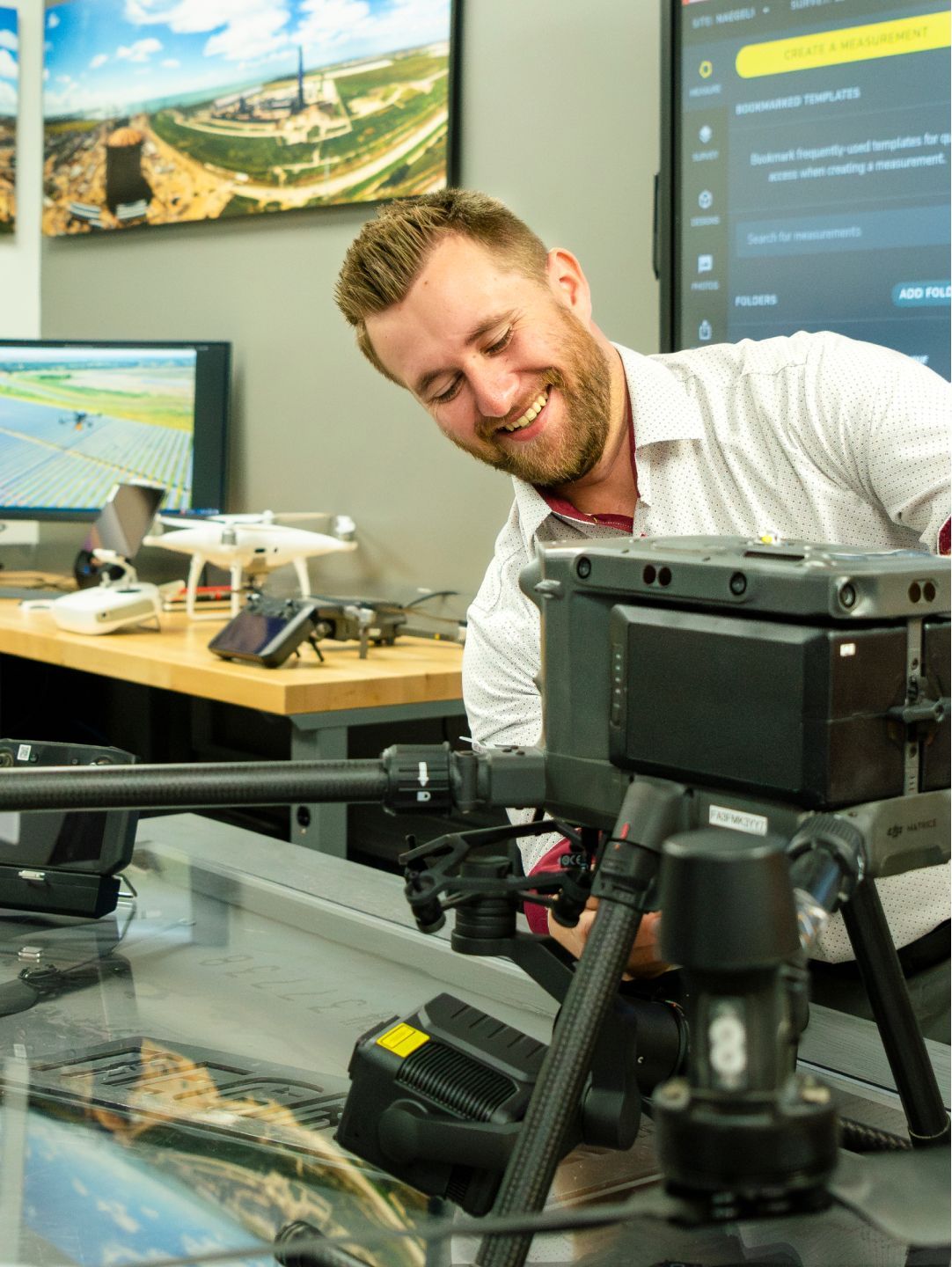 Person working on drone equipment.