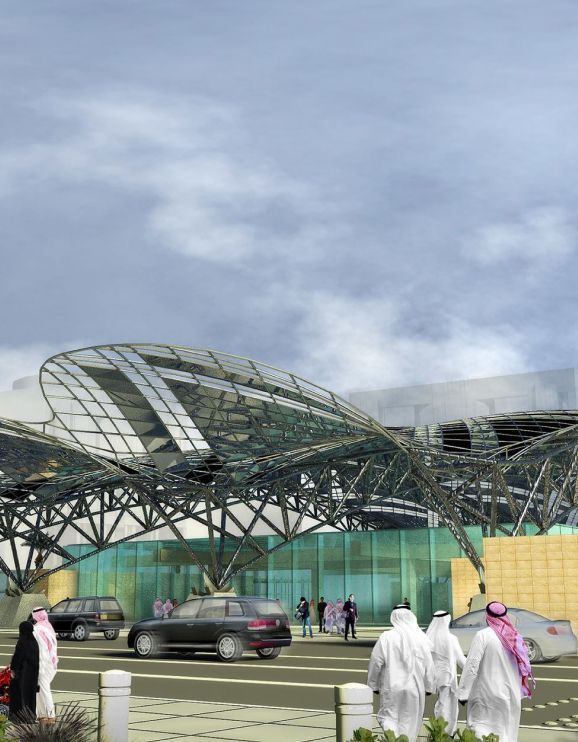 Rendering of the outside of Riyadh Metro, with glass and metal architecture.